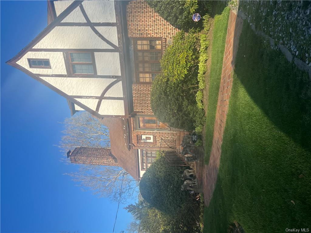 202 Garden Road Larchmont, NY 10538 - Photo 19 of 19 a front view of a house with a yard