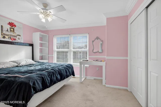 a bedroom with a bed dresser and a window