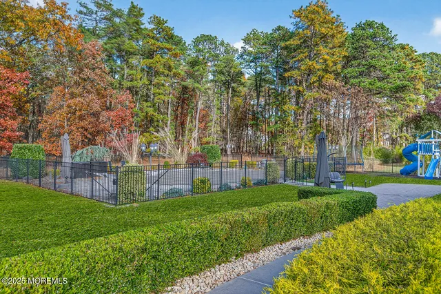 a view of a house with swimming pool and sitting area