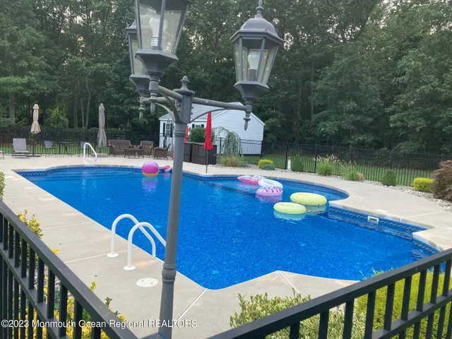 a view of a patio with couches chairs and a fire pit