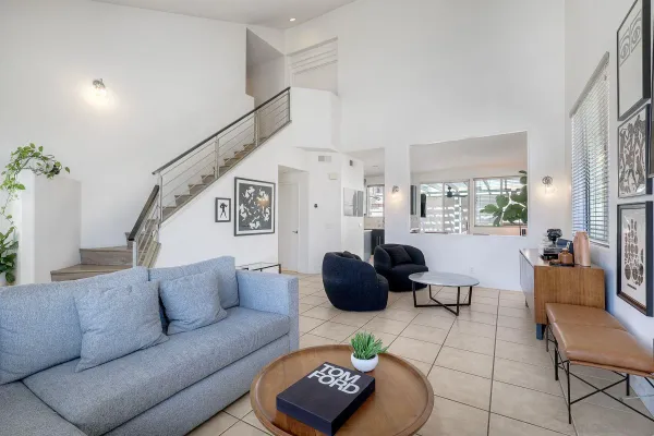 a living room with furniture and a rug