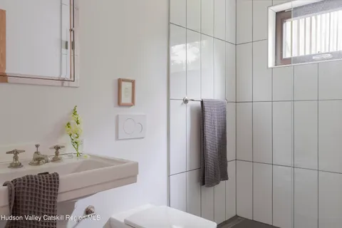 a bathroom with a bathtub and shower