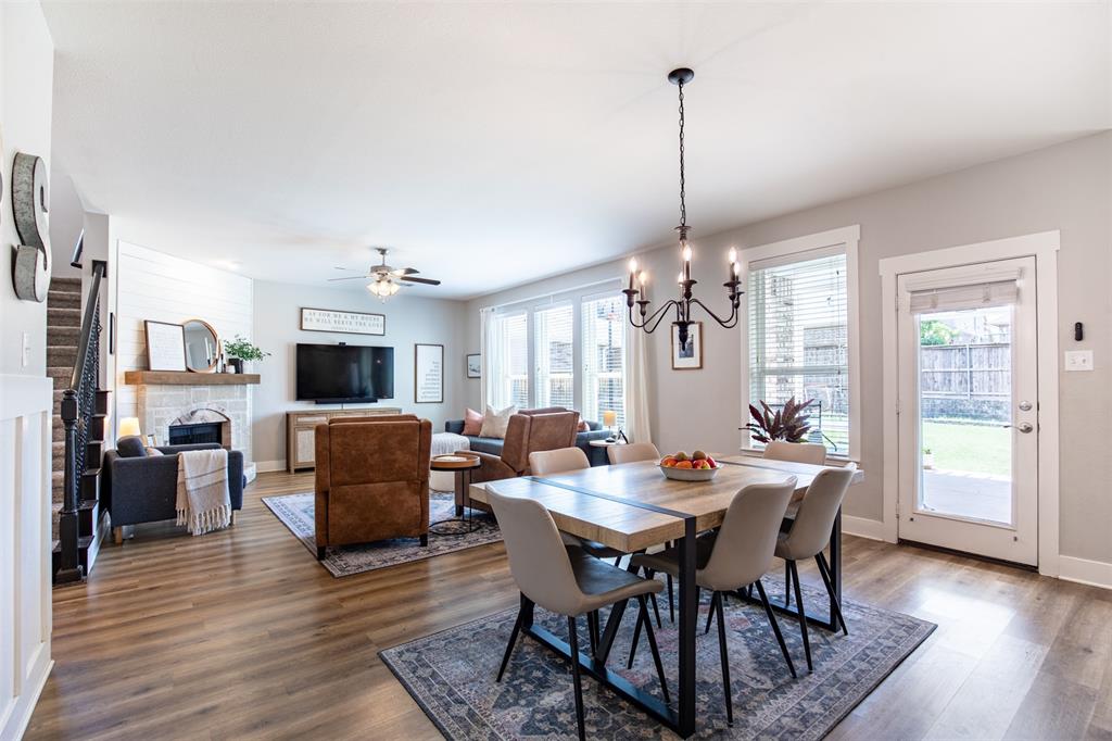 416 Allbright Road Celina, TX 75009 - Photo 14 of 40 a view of a dining room with furniture window and wooden floor