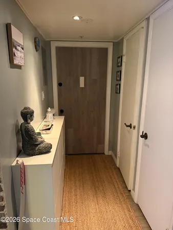a bathroom with a granite countertop sink a mirror and shower