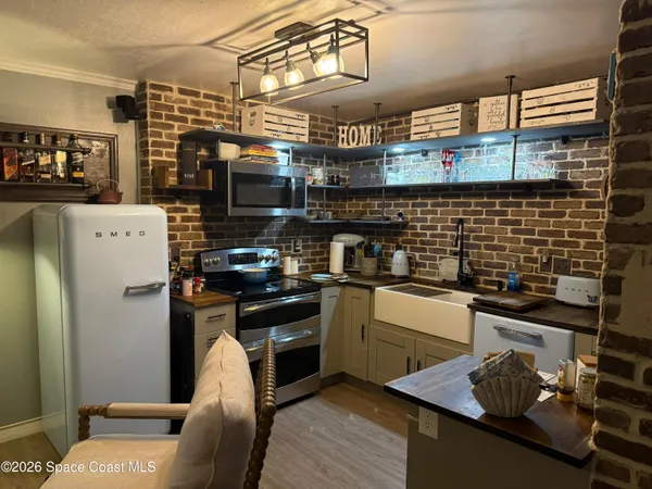 a kitchen with cabinets and appliances