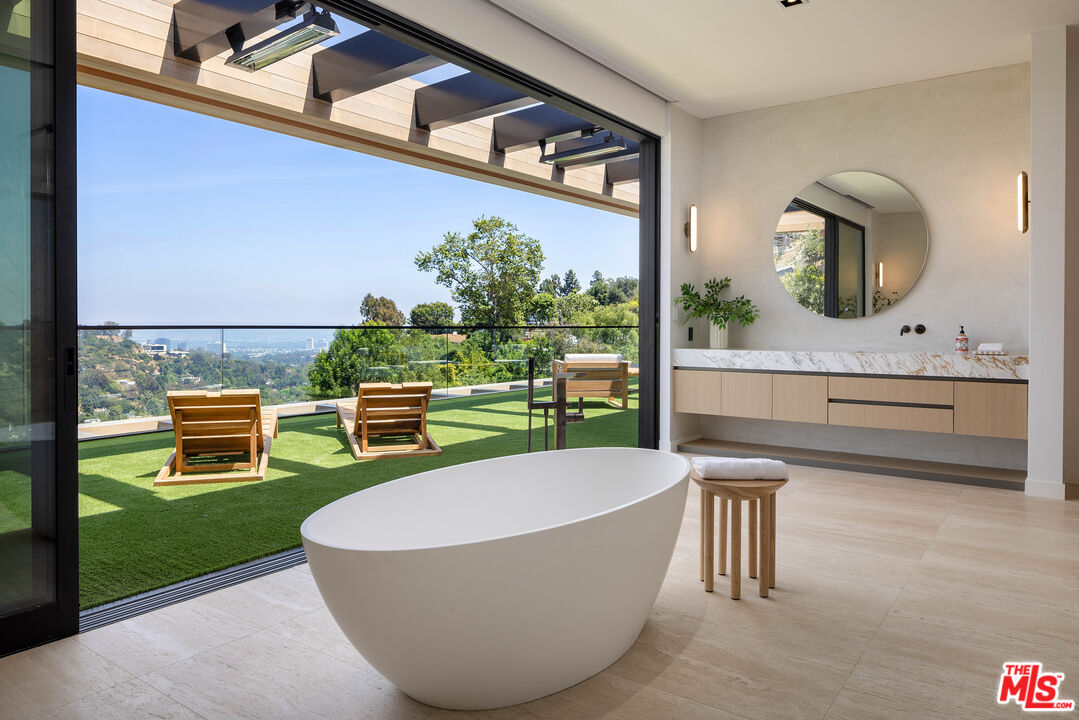 1104 North Tigertail Road Los Angeles, CA 90049 - Photo 13 of 27 a swimming pool with outdoor seating and yard