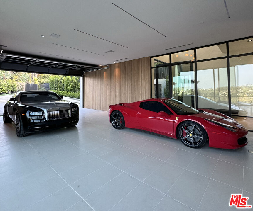 1104 North Tigertail Road Los Angeles, CA 90049 - Photo 16 of 27 a car parked in a garage