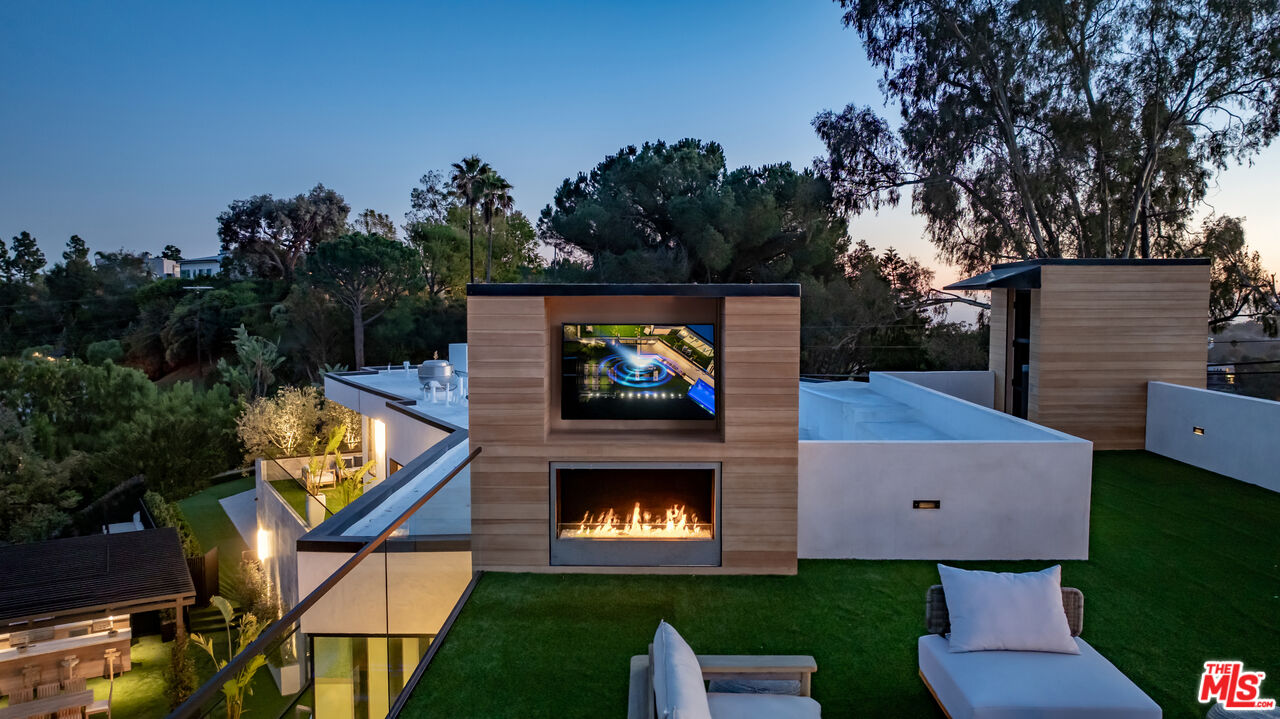 1104 North Tigertail Road Los Angeles, CA 90049 - Photo 17 of 27 swimming pool with yard and outdoor seating