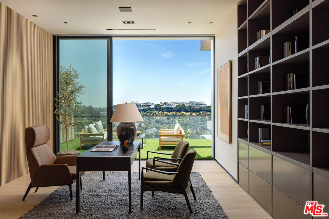 1104 North Tigertail Road Los Angeles, CA 90049 - Photo 10 of 27 a sitting area with furniture and a window
