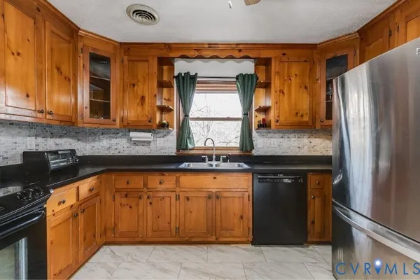 a bedroom with a bunk bed and a table in it