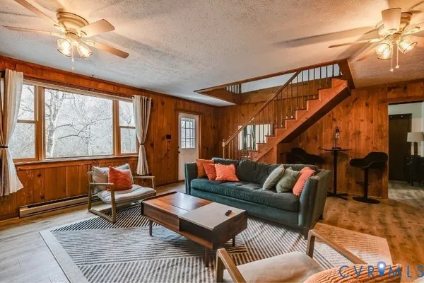 a view of a lake with a mountain and trees in the background