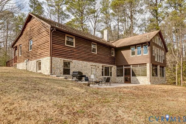 a kitchen with stainless steel appliances kitchen island granite countertop a sink and cabinets