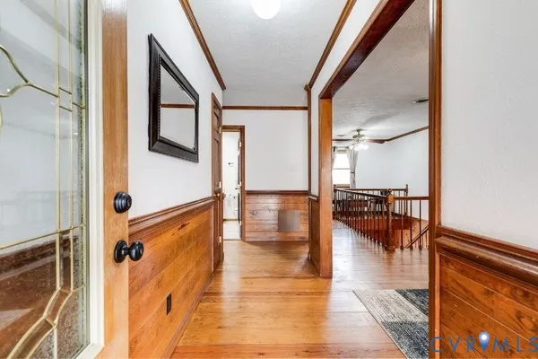 a kitchen with granite countertop stainless steel appliances a stove sink and cabinets