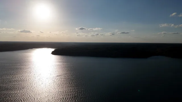 a view of a lake with a yard
