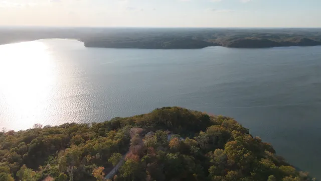 a view of a lake with houses in the back