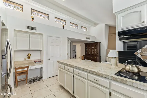 a bedroom with a bed and a cabinets