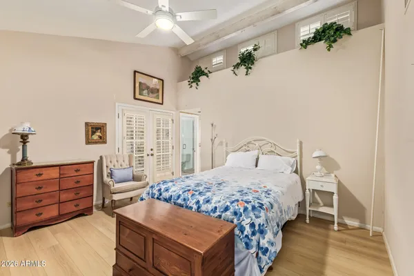 a bedroom with a bed and a dresser