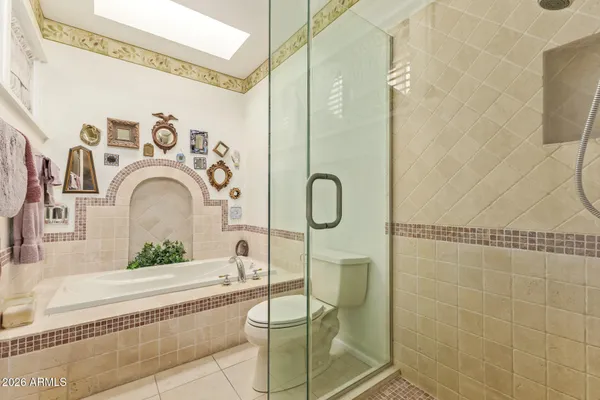 a bathroom with a sink a mirror and a shower