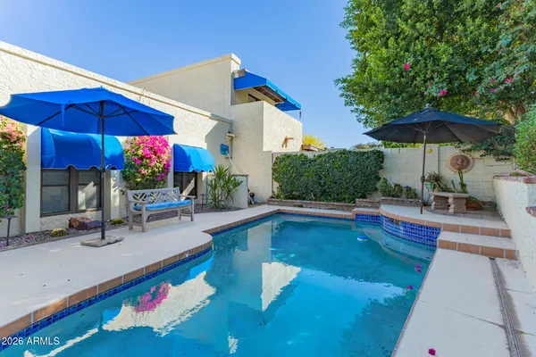 a view of a swimming pool with a patio