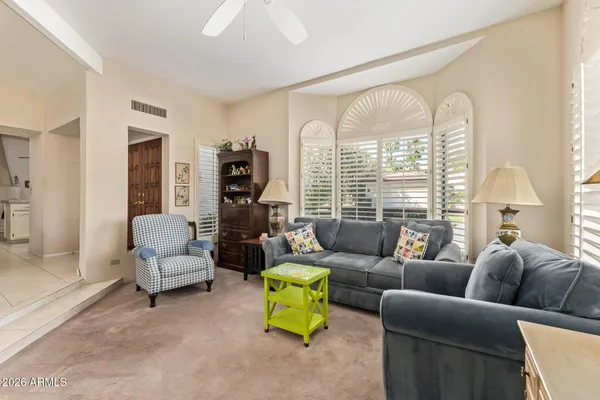 a living room with furniture and a large window
