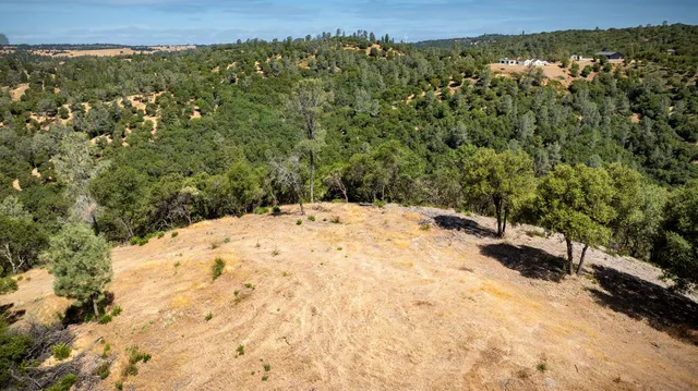 a view of ocean with a mountain