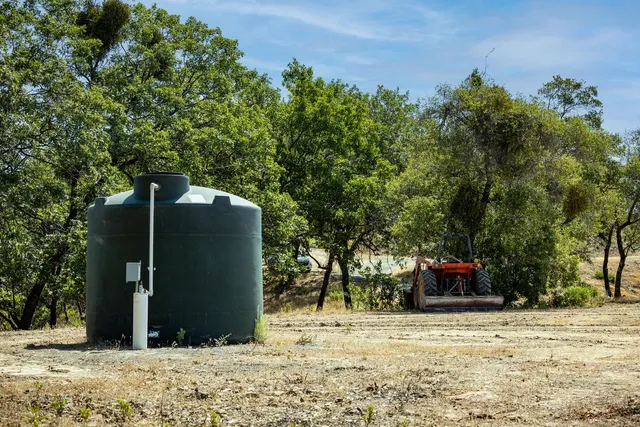 a view of a yard with a lake view