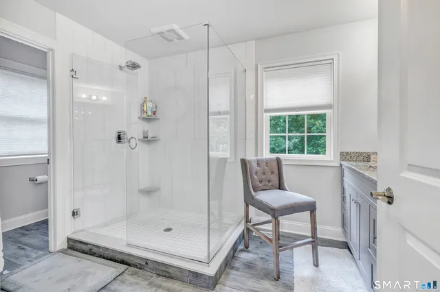 a bathroom with a shower and a sink
