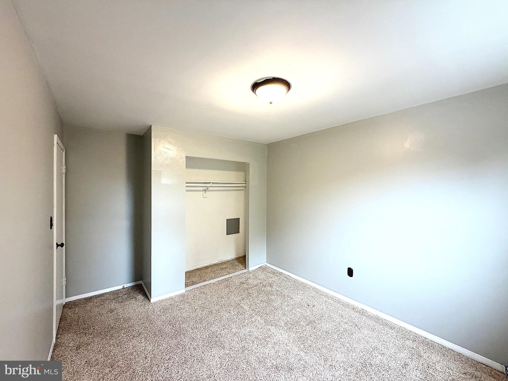 1 Broadleaf Court Baltimore, MD 21234 - Photo 17 of 35 an empty room with an entryway and closet
