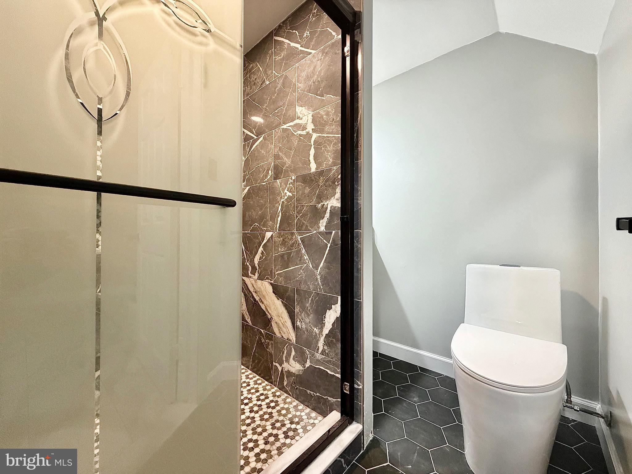 1 Broadleaf Court Baltimore, MD 21234 - Photo 24 of 35 a white toilet sitting next to a shower curtain