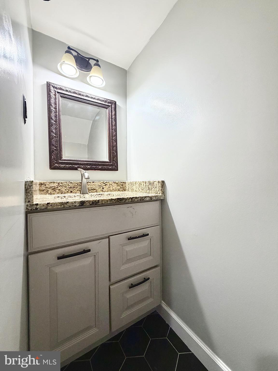 1 Broadleaf Court Baltimore, MD 21234 - Photo 27 of 35 a bathroom with a sink a vanity and a mirror