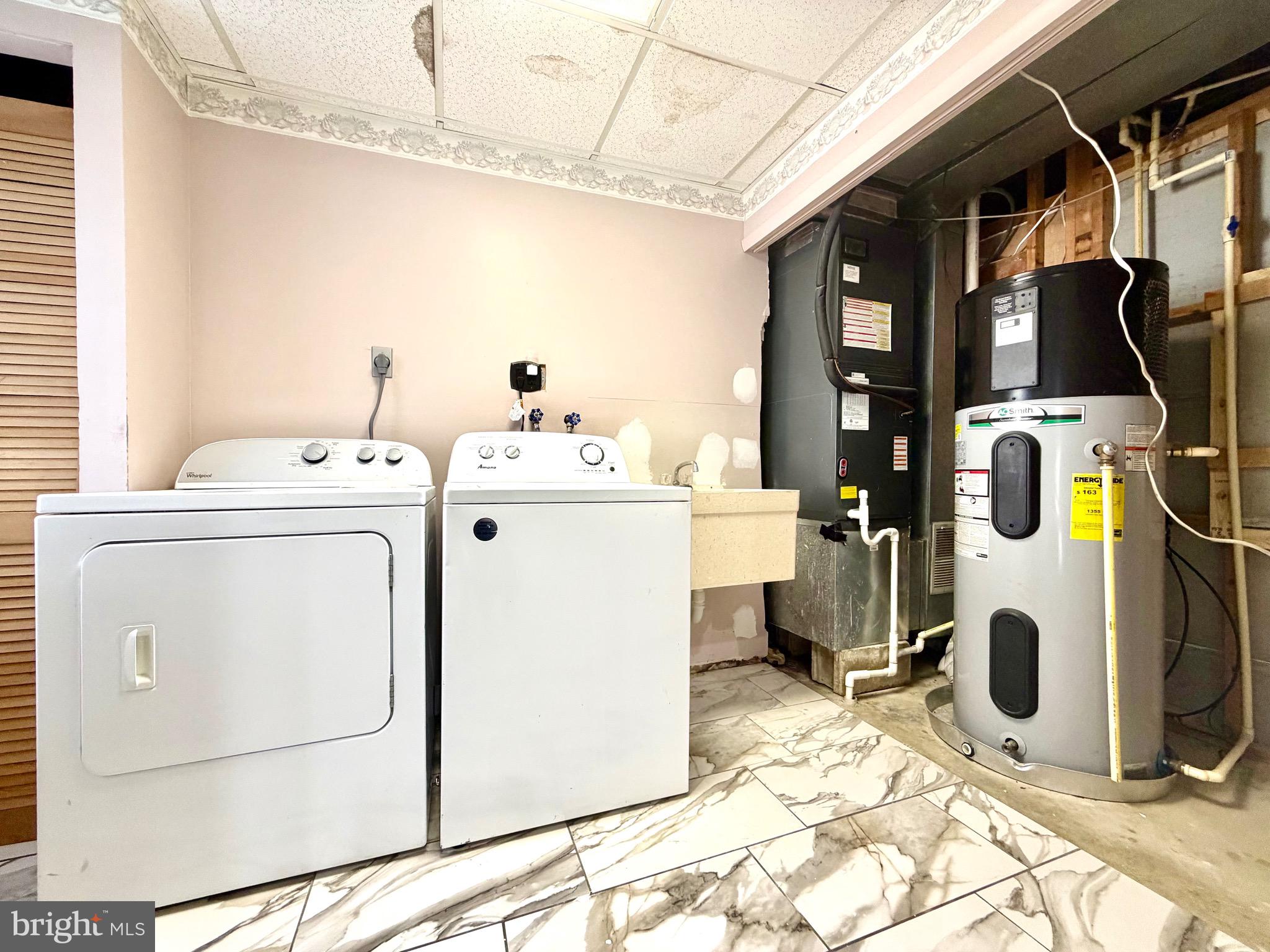 1 Broadleaf Court Baltimore, MD 21234 - Photo 28 of 35 a utility room with dryer and washer