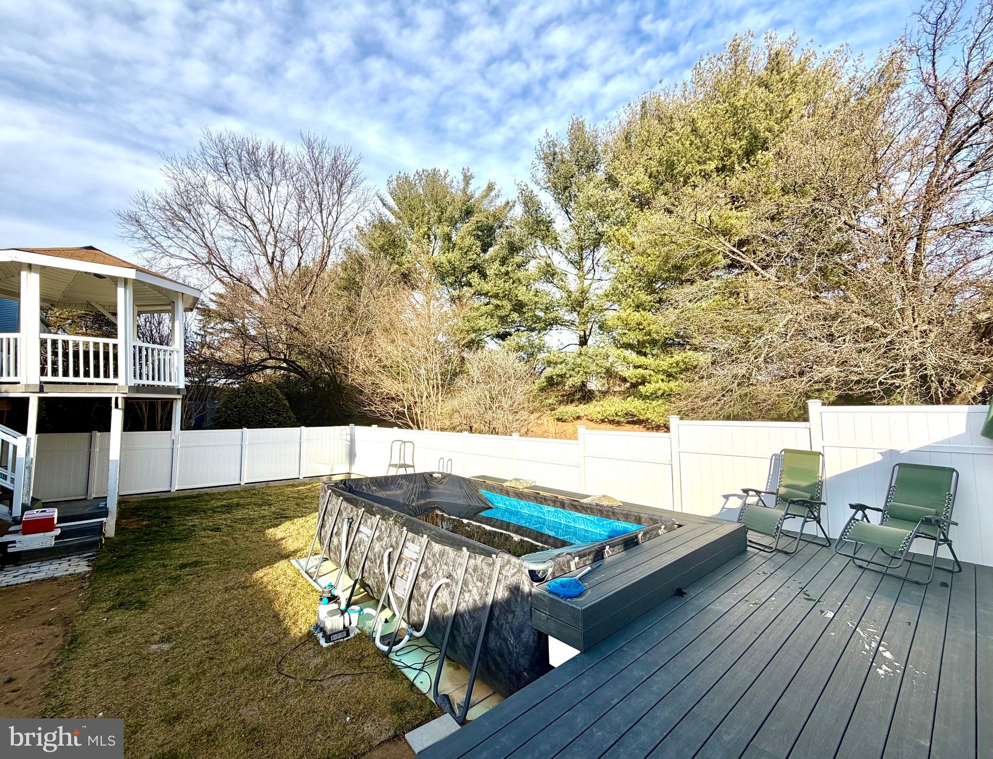 1 Broadleaf Court Baltimore, MD 21234 - Photo 32 of 35 a view of a balcony with chair and wooden floor