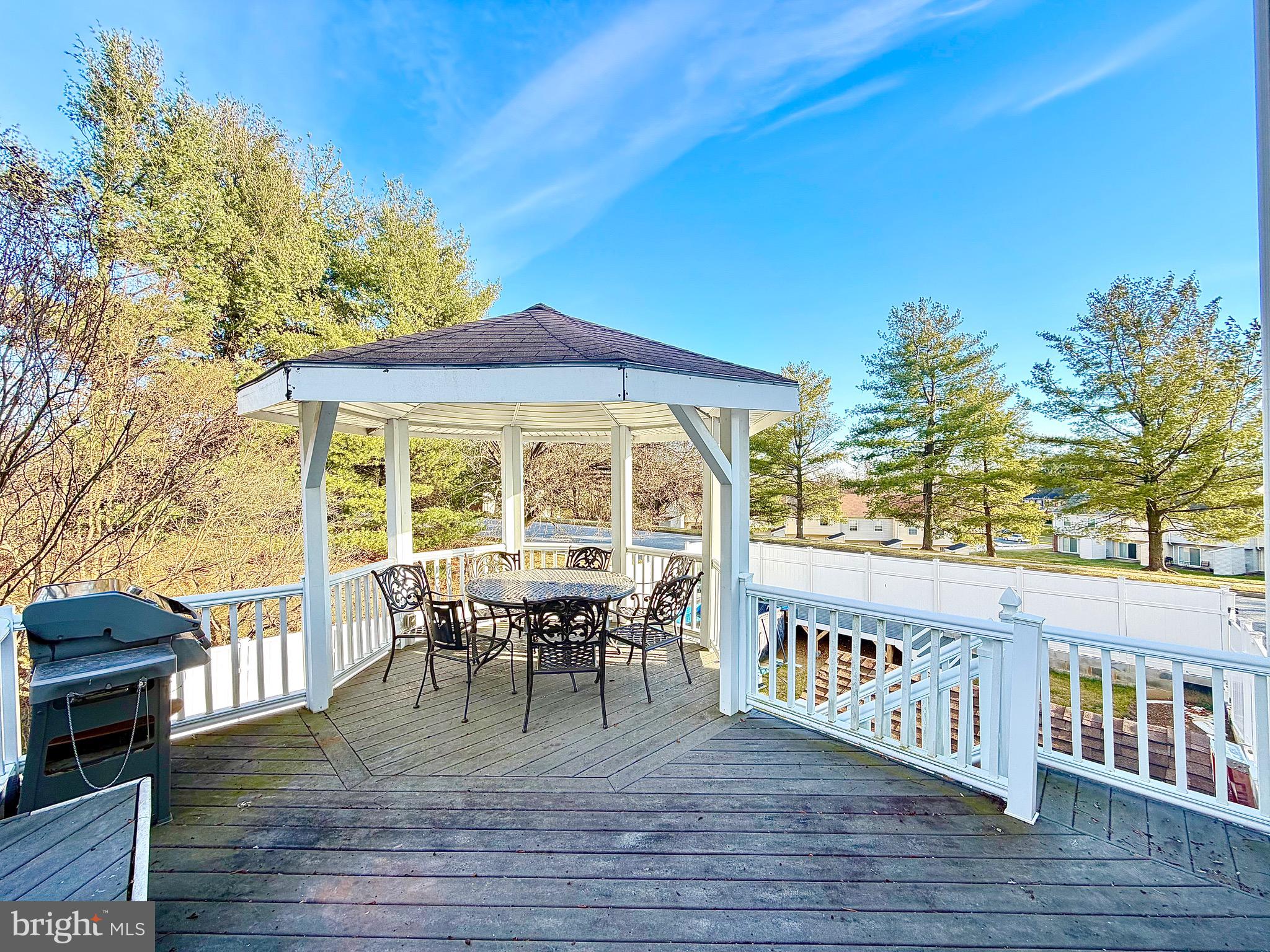 1 Broadleaf Court Baltimore, MD 21234 - Photo 33 of 35 a view of a roof deck with table and chairs a barbeque with wooden floor and fence