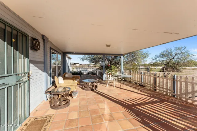 a view of a patio with wooden floor