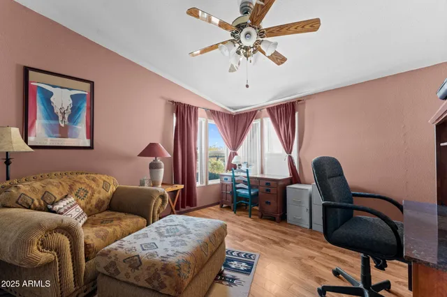 a view of a livingroom with furniture and a window