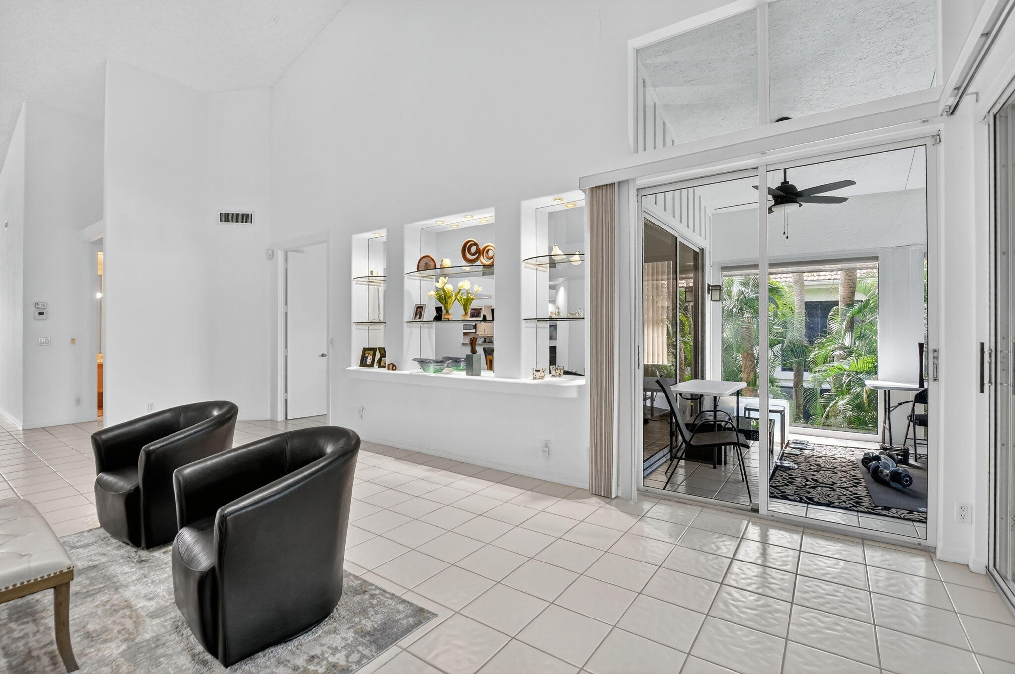 5781 Northwest 24th Avenue, Unit 902 Boca Raton, FL 33496 - Photo 18 of 72 Living area/entry to enclosed patio