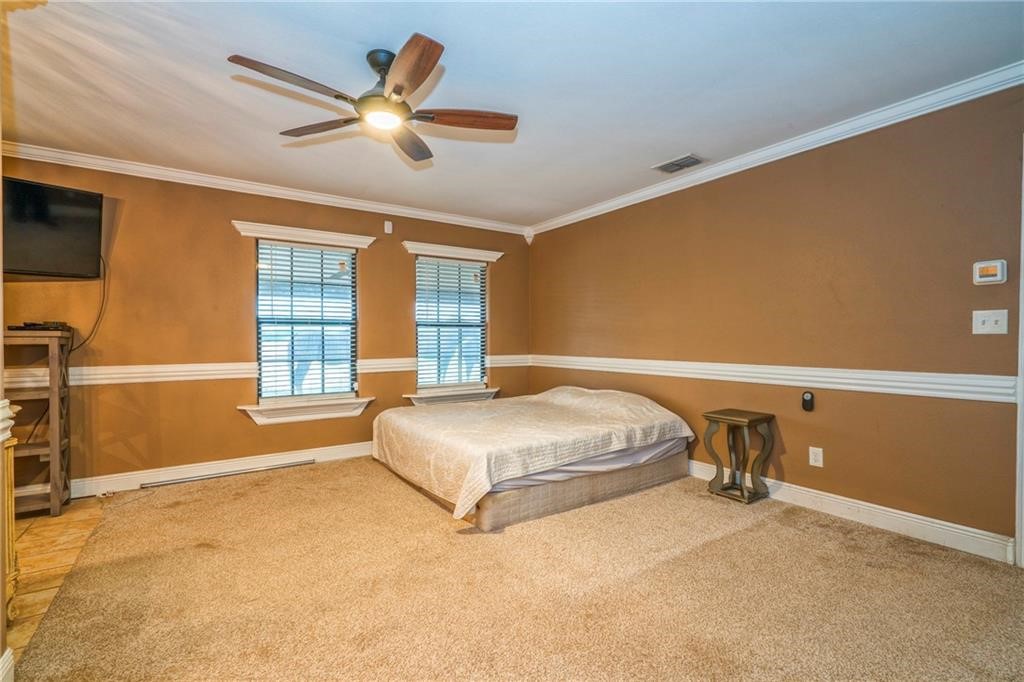 7084 Bartosch Road Robstown, TX 78380 - Photo 14 of 35 a bedroom with a bed and window