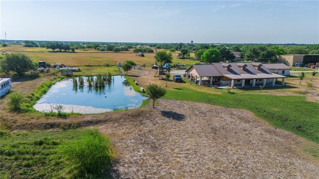 7084 Bartosch Road Robstown, TX 78380 - Photo 33 of 35 an aerial view of residential houses with outdoor space and lake view