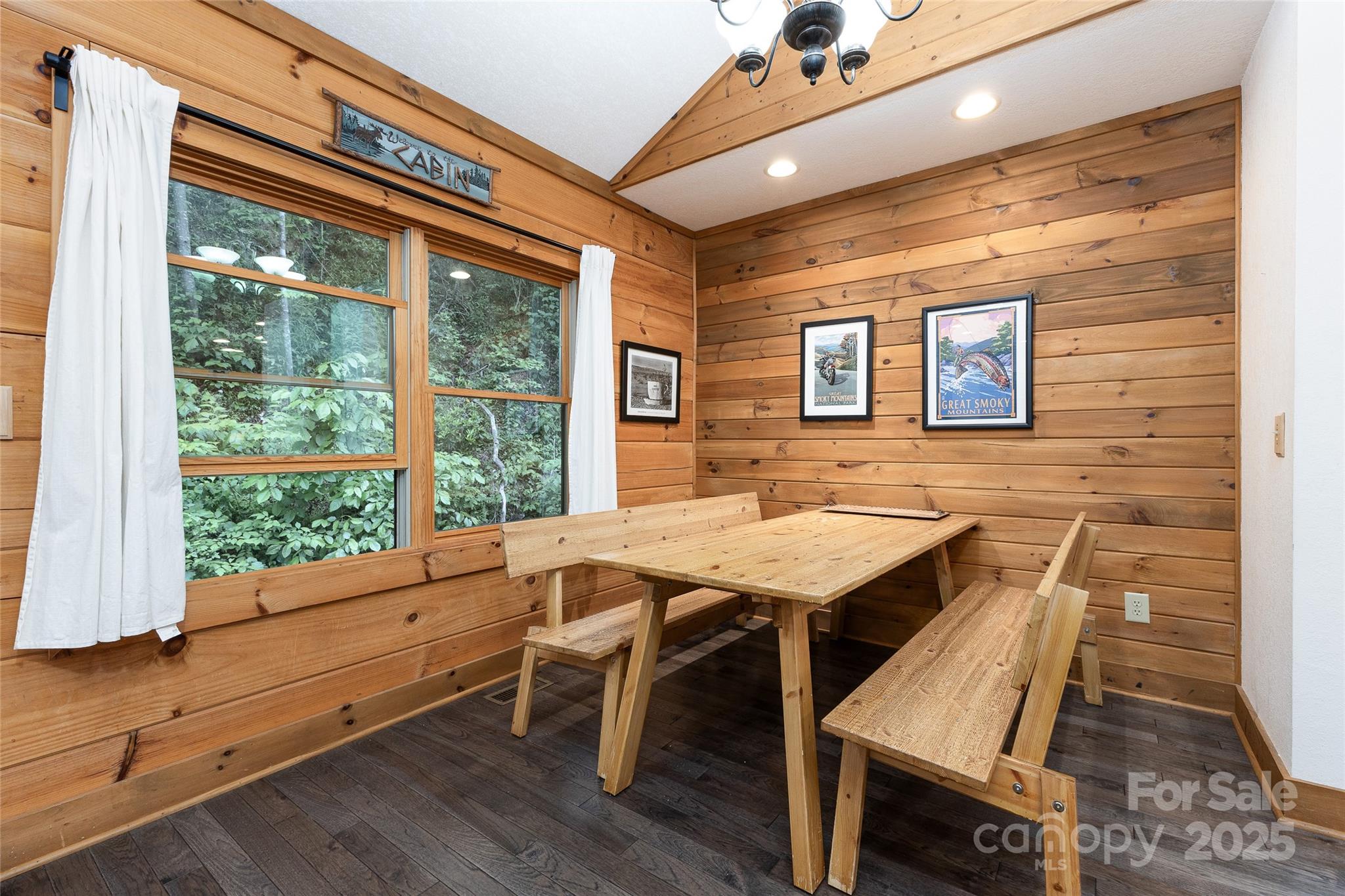 242 Eagles Roost Road Bryson City, NC 28713 - Photo 15 of 33 a view of a dining room with furniture window and wooden floor