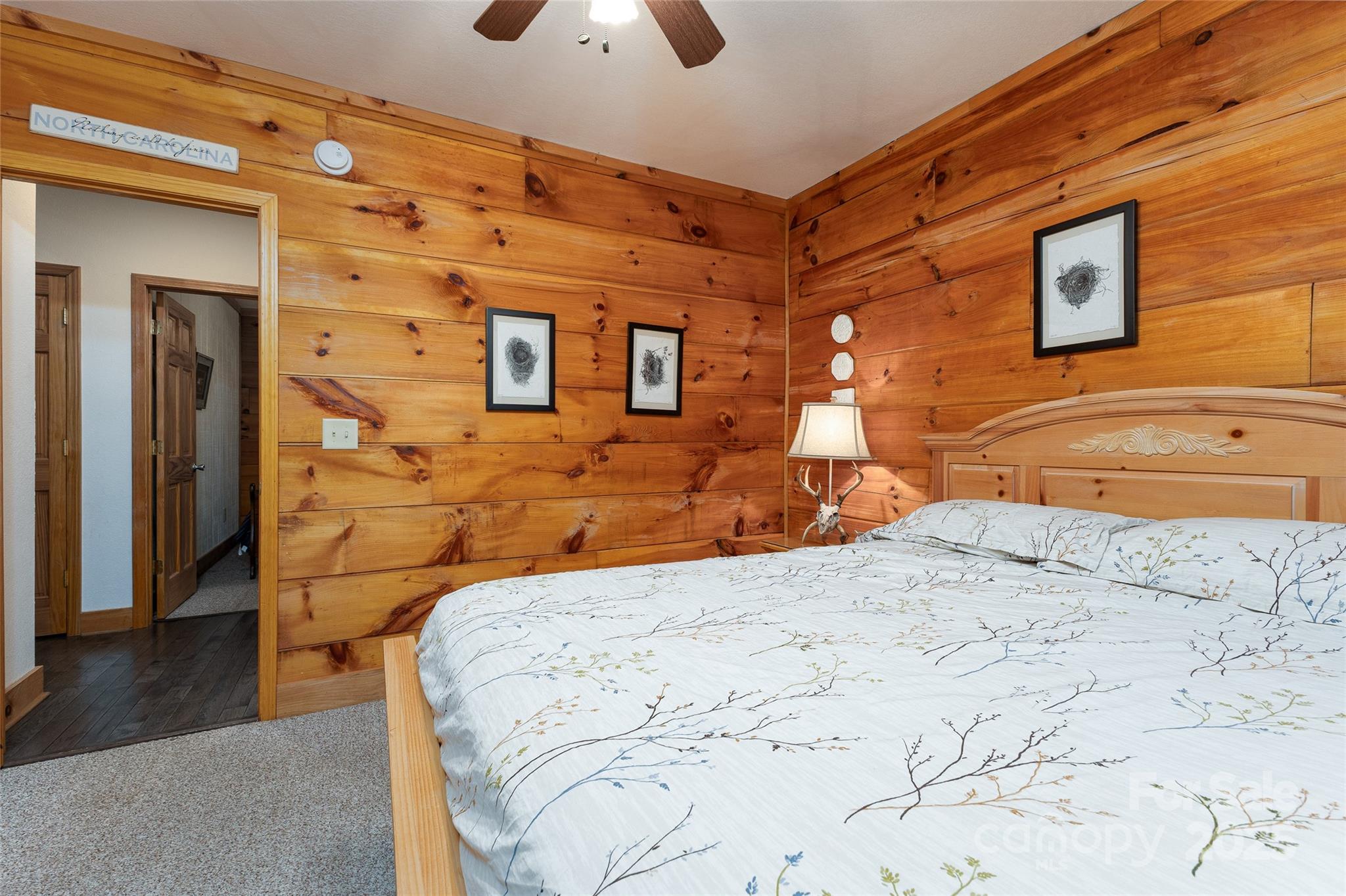 242 Eagles Roost Road Bryson City, NC 28713 - Photo 19 of 33 a bedroom with a bed and a dresser