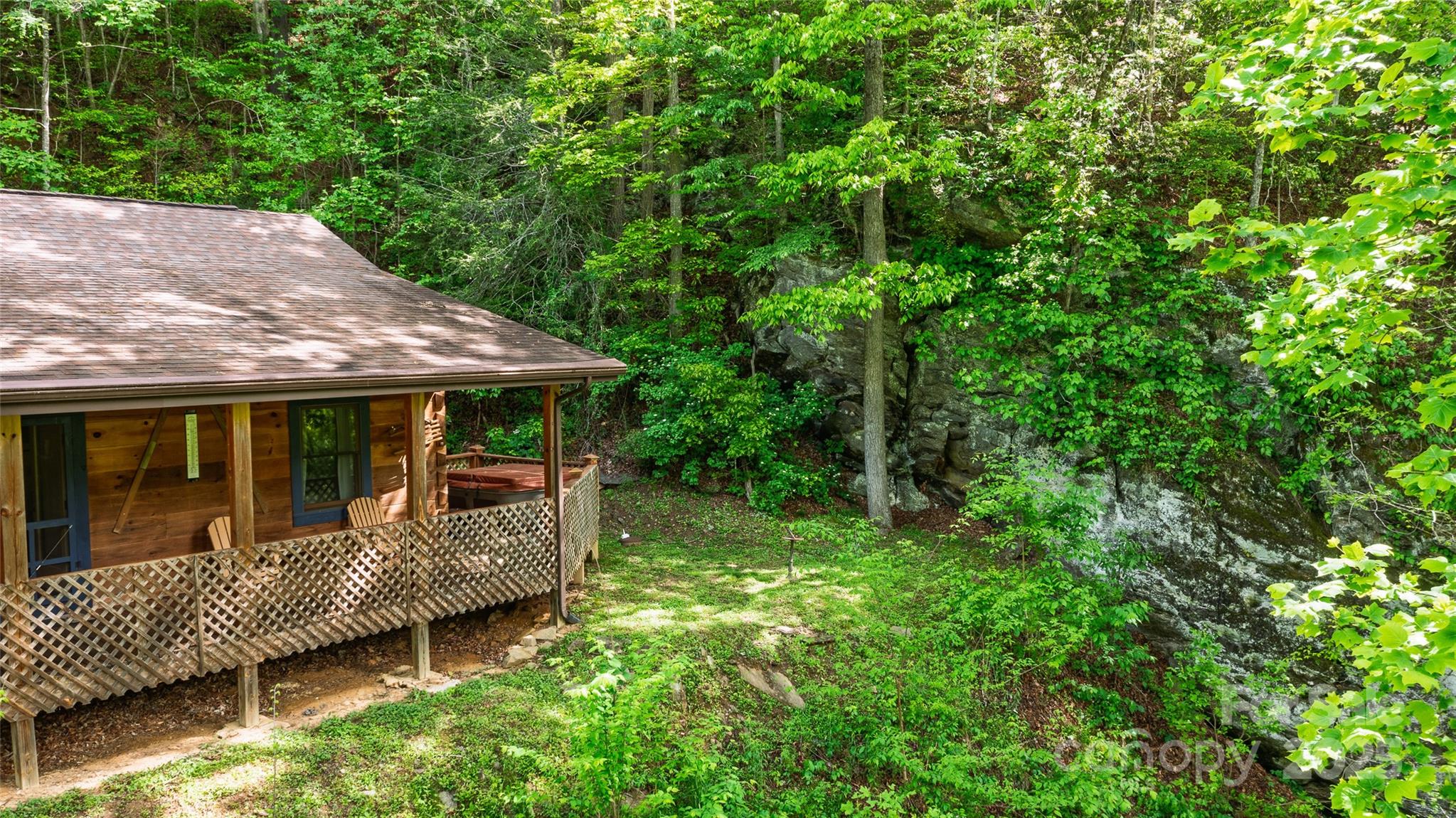242 Eagles Roost Road Bryson City, NC 28713 - Photo 2 of 33 aerial view of a house with a yard and sitting area