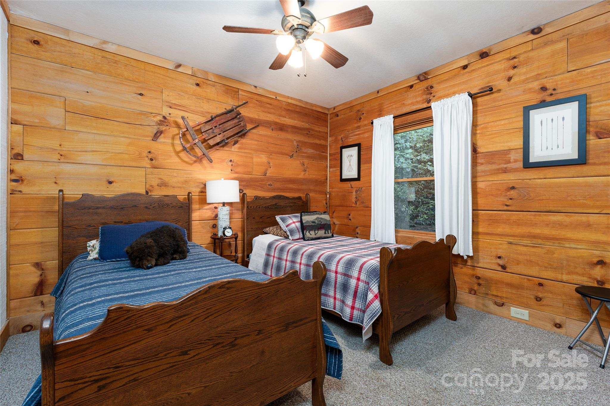242 Eagles Roost Road Bryson City, NC 28713 - Photo 22 of 33 a bedroom with bed and a window