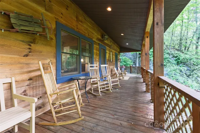a view of a patio with table and chairs with wooden floor and floor