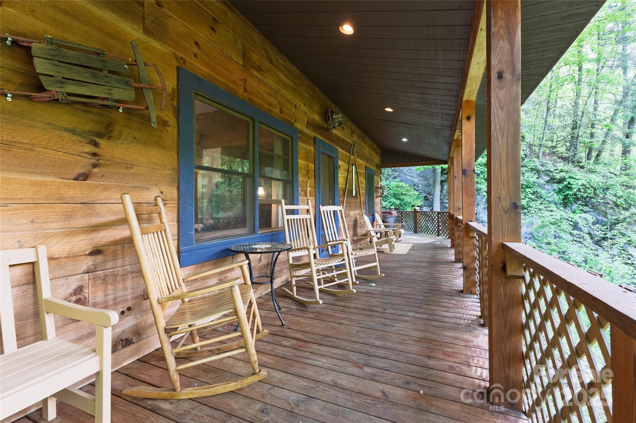 242 Eagles Roost Road Bryson City, NC 28713 - Photo 25 of 33 a view of a patio with table and chairs with wooden floor and floor