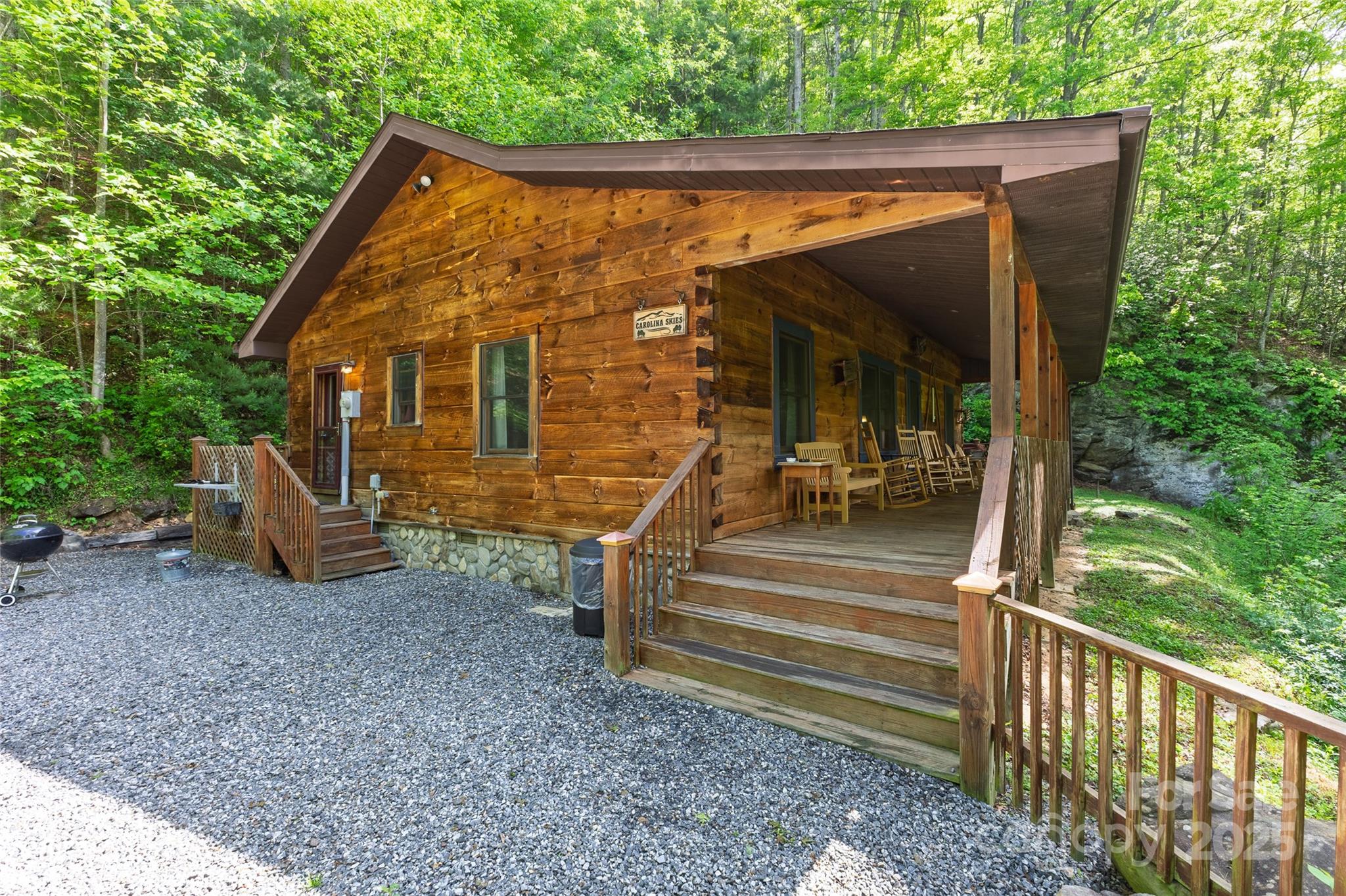 242 Eagles Roost Road Bryson City, NC 28713 - Photo 3 of 33 a view of a house with backyard and porch