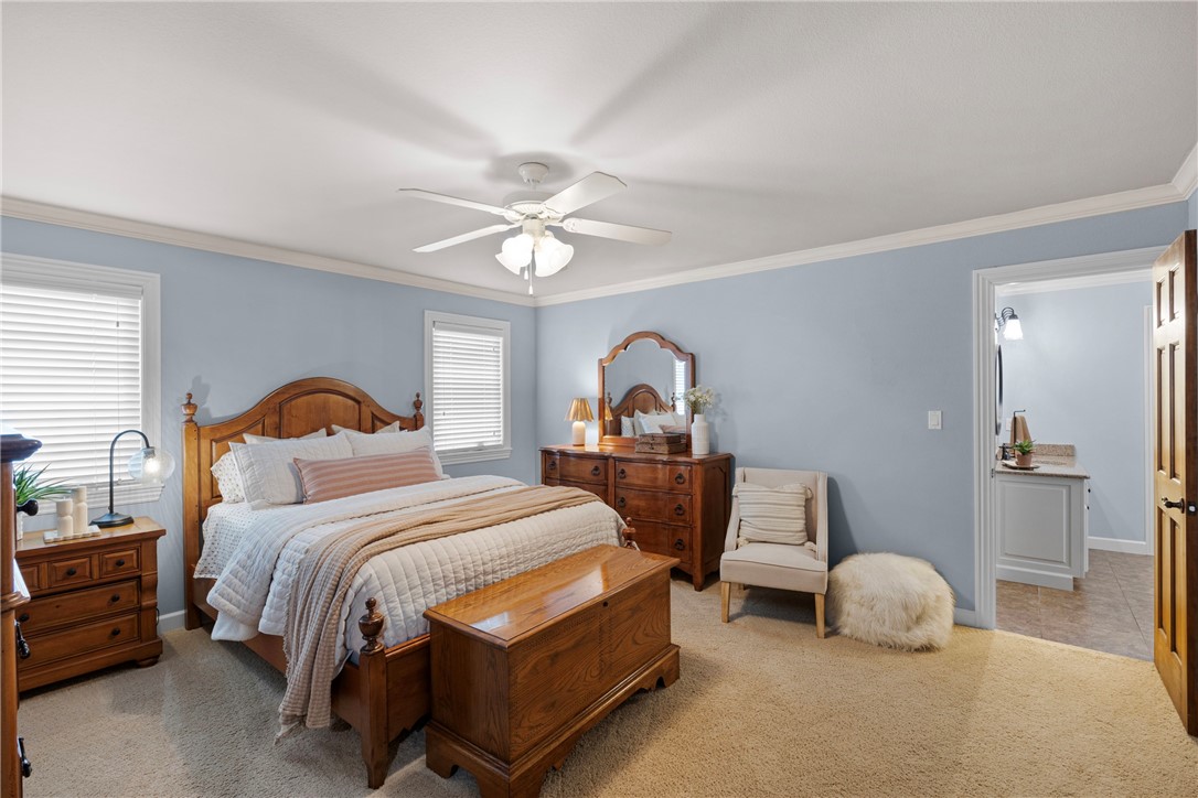 788 Cliff Road Russellville, AR 72802 - Photo 38 of 60 Bedroom featuring ornamental molding, ceiling fan, and light carpet