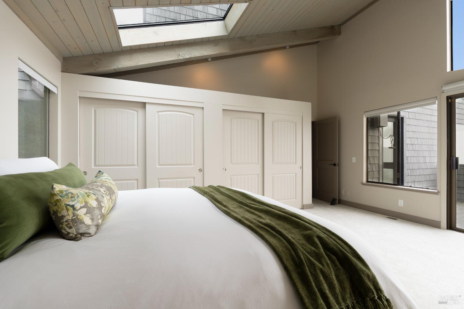 Undisclosed Address The Sea Ranch, CA 95497 - Photo 13 of 46 a bedroom with a bed and a large window