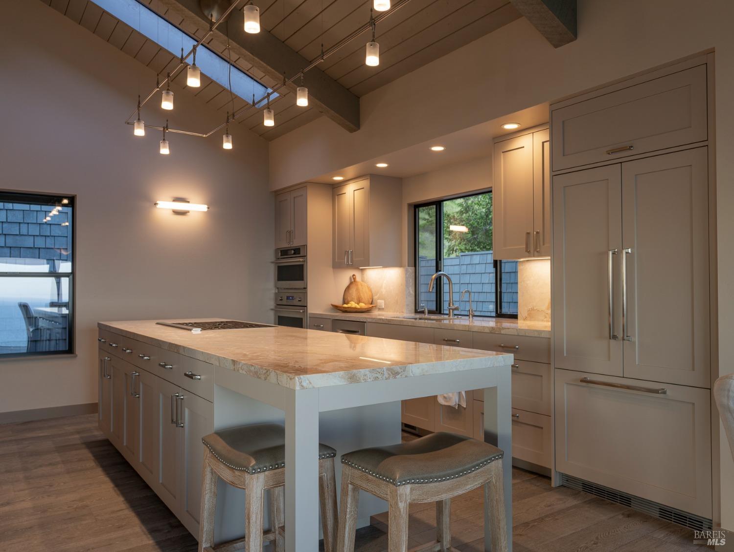 Undisclosed Address The Sea Ranch, CA 95497 - Photo 17 of 46 a kitchen with a table chairs refrigerator and microwave