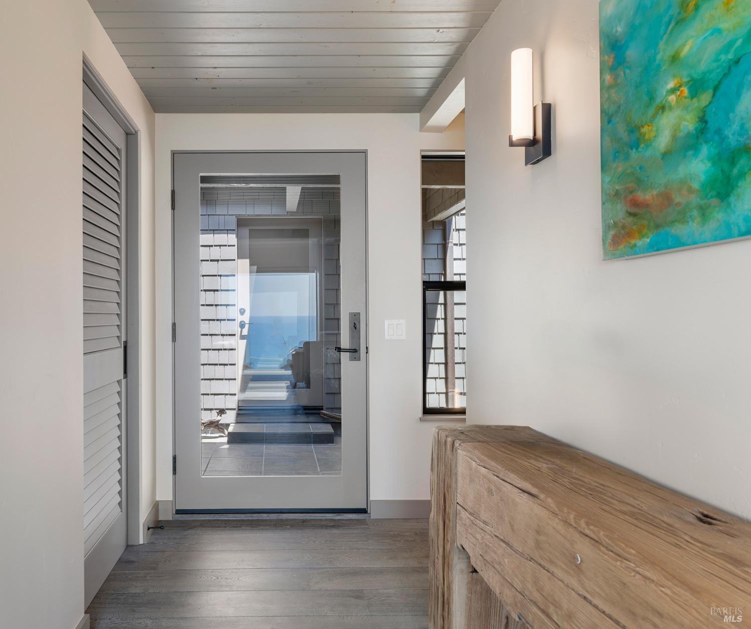 Undisclosed Address The Sea Ranch, CA 95497 - Photo 10 of 46 wooden floor in an empty room with a window