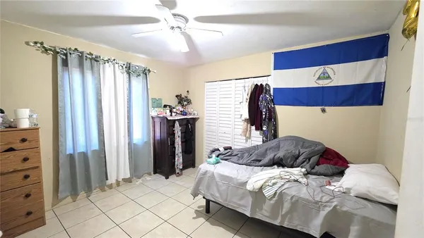 a bedroom with a bed and a closet